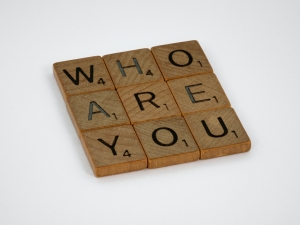 wooden scrabble pieces spelling who are you