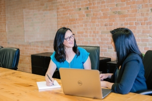 two women sat in an office having an interview