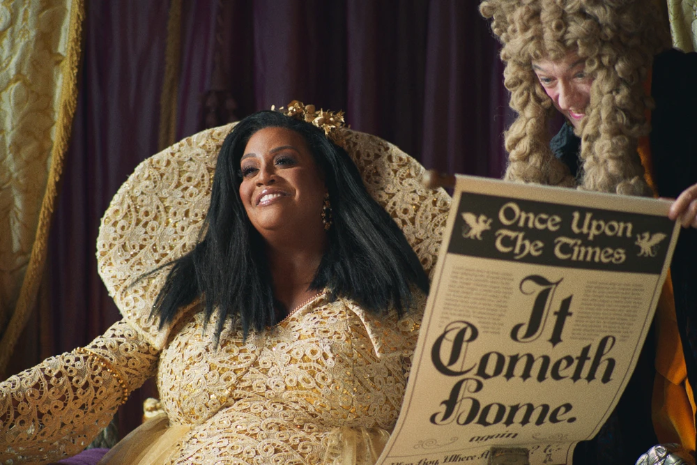 Alison Hammond as The Countess reading a newspaper that says It Cometh Home in Sainsburys Christmas advert 2022